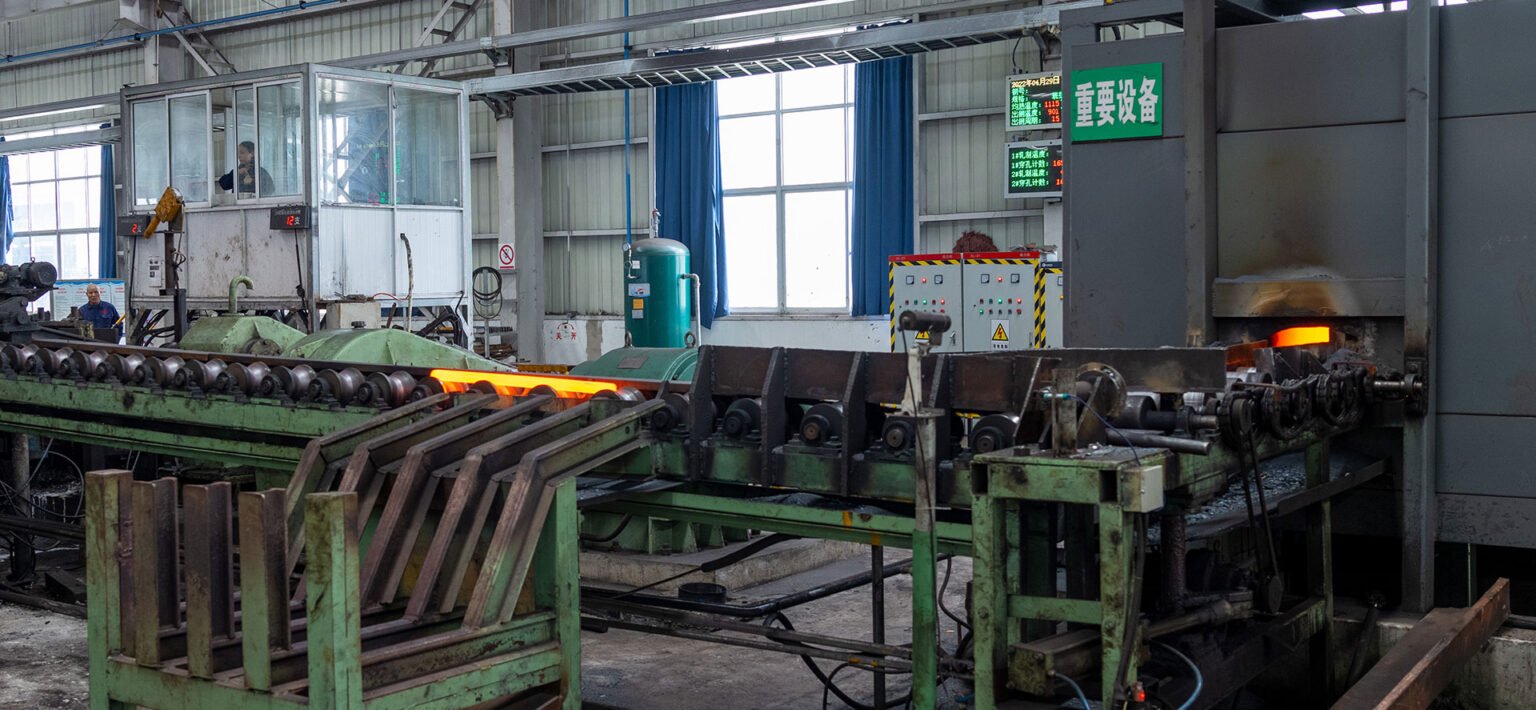 Steel tube billets undergoing the hot piercing process in a heating furnace